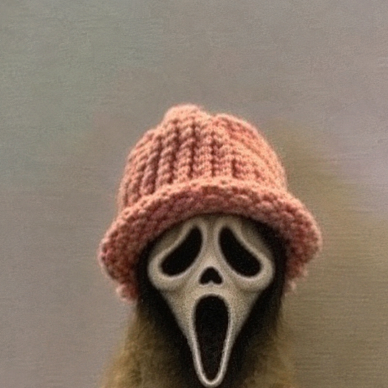 Screaminu wearing a pink knitted beanie